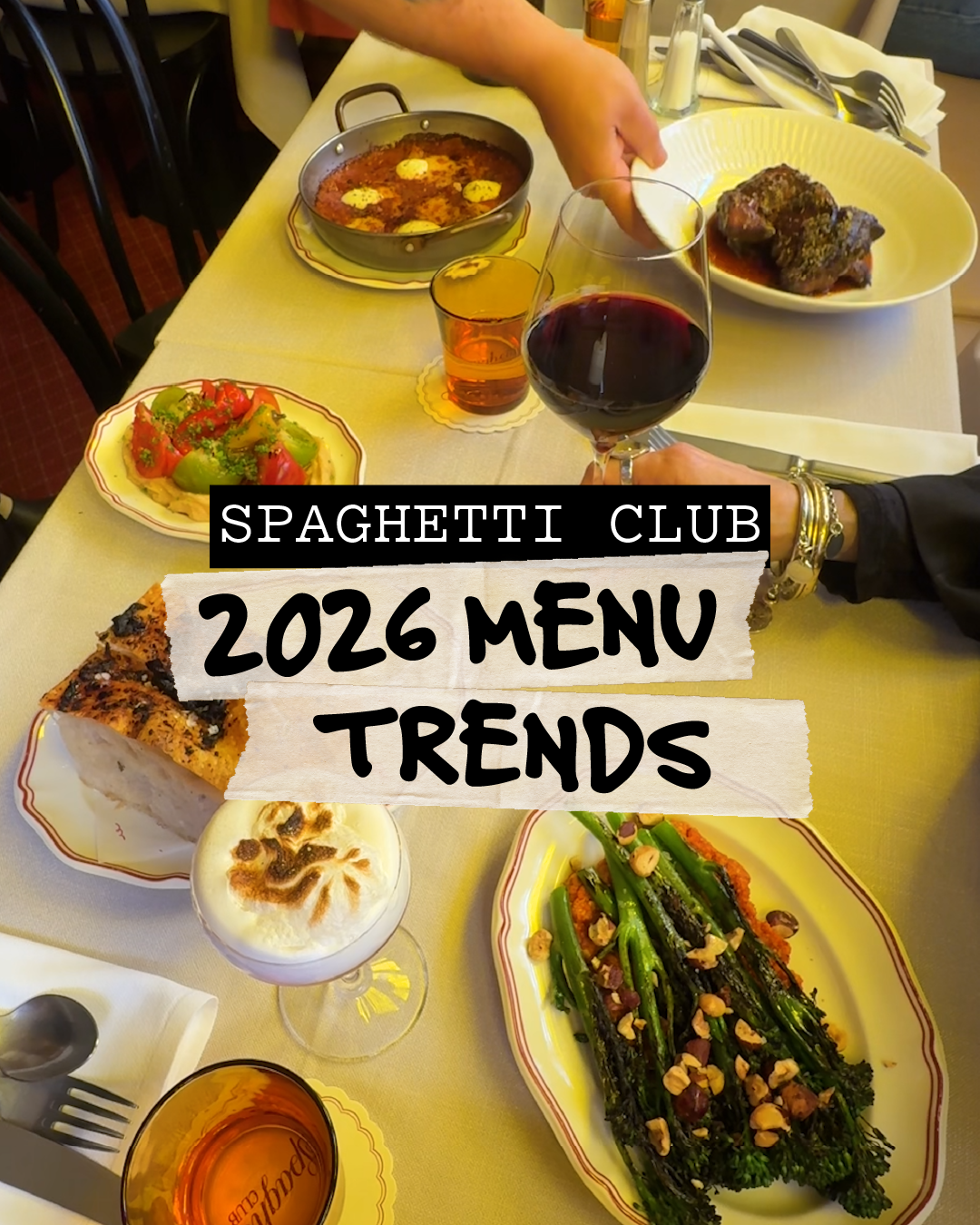 Roasted broccolini, bruschetta and a glass of red wine at the Spaghetti Club in Richmond. A spread of dishes on the table at Spaghetti Club in Richmond, including roasted broccolini, bruschetta and a glass of red wine